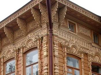 Пример отделки фасада коричневого цвета в деревенском стиле