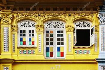Пример отделки фасада дома желтого цвета в ампир стиле