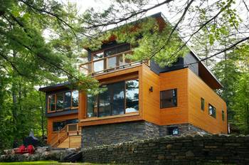 Отделка фасада дома оранжевого цвета в шале стиле