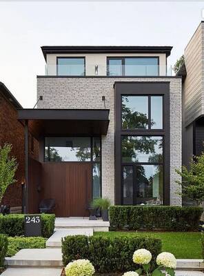 Пример отделки фасада дома серого цвета в современном стиле