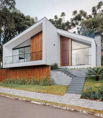 Дизайн фасада дома коричневого цвета в барнхаус стиле